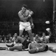Muhammad Ali stands over a “defeated” Sonny Liston, 1965. Photo by John Rooney/AP